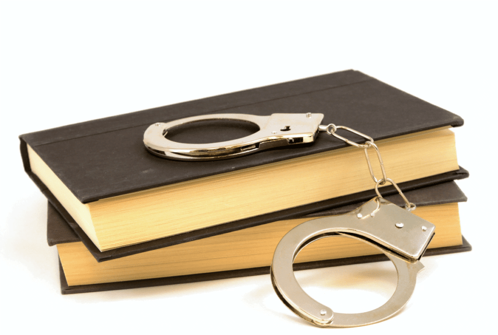 handcuffs and books